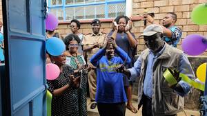 Dr. Abdoul Aziz Niane cutting the ribbon 