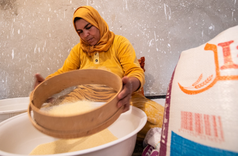 A Morocco cooperative member using industrial flour to make couscous instead of the local harvested grains