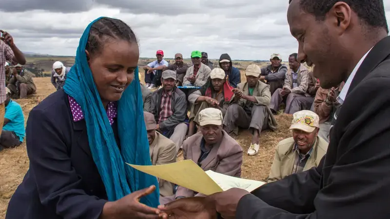 A farmer in Ethiopia receives a certificate after completing a course on wheat rust management A farmer in Ethiopia receives a certificate after completing a course on wheat rust management